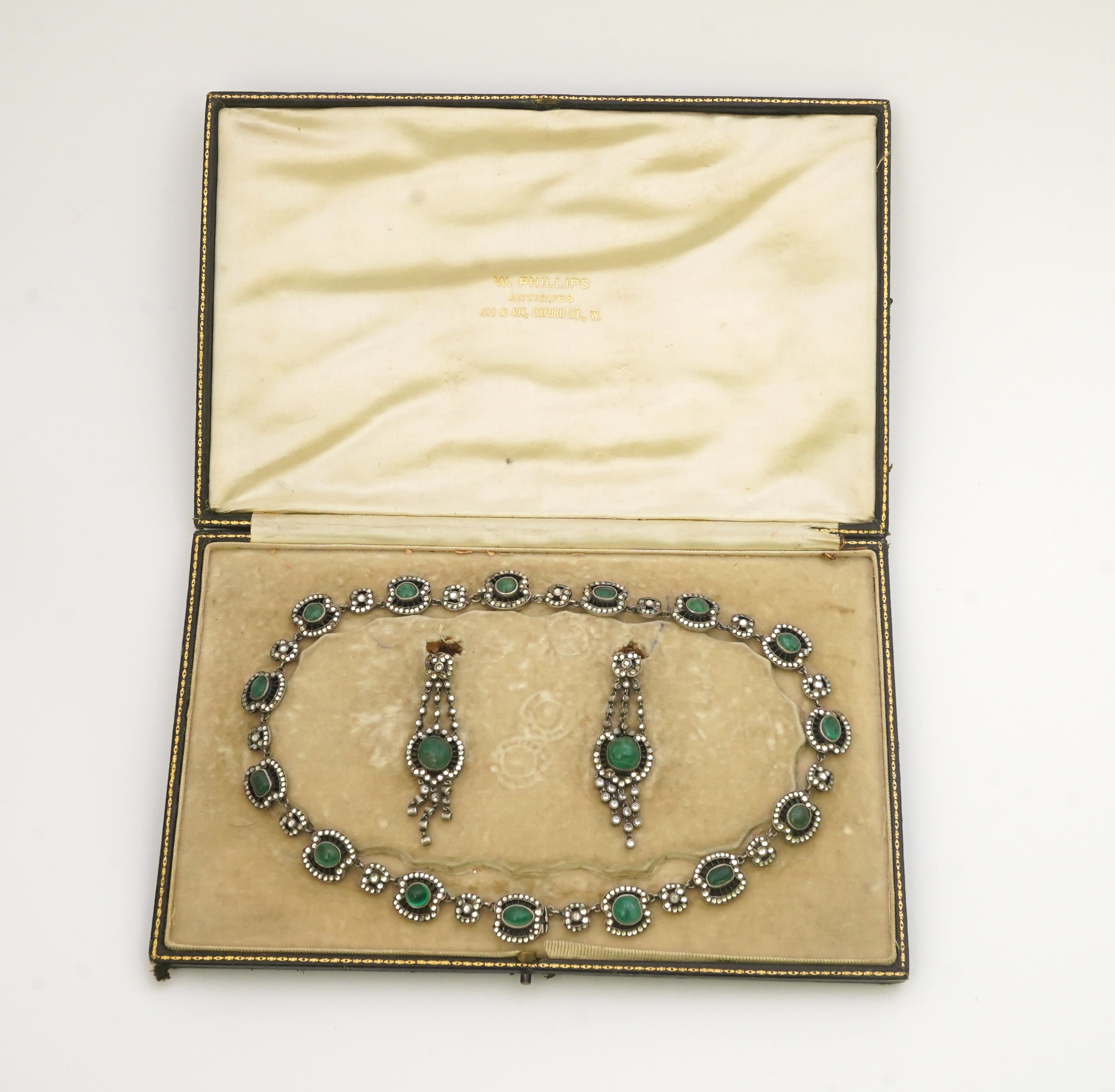 An emerald and rock crystal demi-parure, France, early 20th century